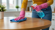 © StockWorld - Cleaning Time! Woman Wiping Table with Spray and Cloth in Pink Gloves - Housework, Hygiene, & Sparkling Cleanliness!