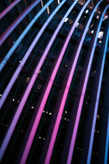 Poster - Futuristic Neon Arches Illuminated in Vibrant Blues and Purples for Modern Urban Aesthetic