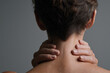 © Inspire Shots Hub - Close-up of woman's neck and hands, showcasing skin texture and suggesting tension or discomfort, representing health, wellness, or body care