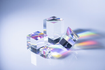 Poster - Elegant Crystal Cubes Reflecting Light in a Prismatic Dance of Colors on a Soft Background