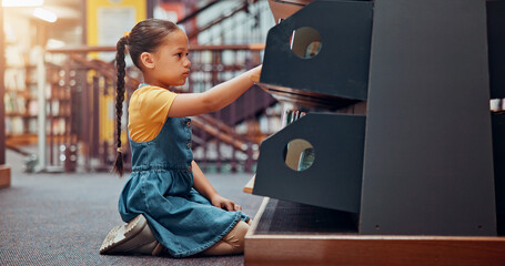 Poster - Shelf, choice and child with books in library for reading story, literature and learning. School, bookstore and girl on floor with decision or search for knowledge, education and language development