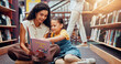 © Jessy/peopleimages.com - Kid, help or teacher reading book for learning, child development or talking in school. Teaching, smile or woman with girl or student in library for literature lesson, fairy tale or education support