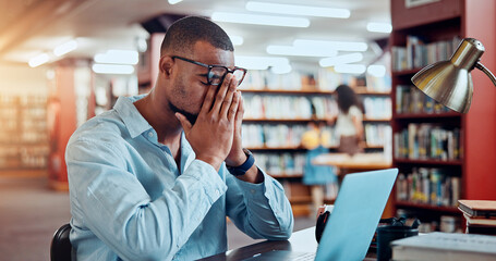 Poster - Black man, laptop and stress in library for education, research or project deadline for university student. African person, glasses and headache with eye strain on campus for overtime or burnout