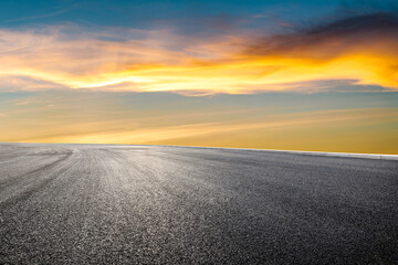 Wall Mural - asphalt road and beautiful sky clouds at sunset