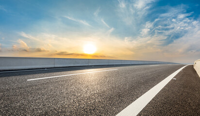 Wall Mural - asphalt road and beautiful sky clouds at sunset