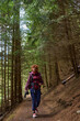 © Xalanx - Woman hiking on forest trail