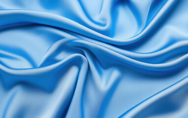 Poster - Soft blue satin fabric drapes elegantly, showcasing its smooth texture and sheen, perfect for various design projects