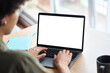 © insta_photos - Over shoulder view of African American woman student elearning looking at white mock up blank screen using laptop computer learning online, hybrid working. Website mockup display template for ads.