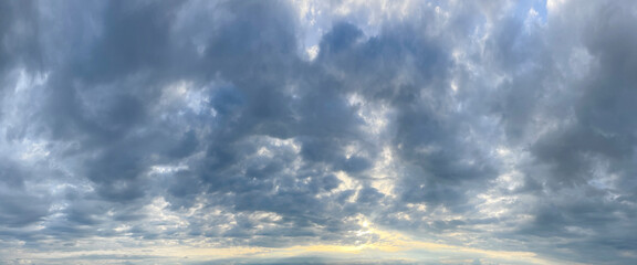 Wall Mural - stormy sky with cloud and sun light. nature background, skyline landscape