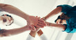 © peopleimages.com - Stack of hands, collaboration and doctor with nurses in hospital for celebration, achievement or support. Medical team, synergy and group of healthcare workers with community in clinic from below.
