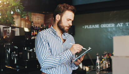 Poster - Coffee shop, online and man on tablet in cafe for menu items, inventory and order checklist. Restaurant, hospitality and business owner on digital tech for internet, planning and review on website