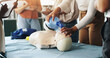 © peopleimages.com - Group, cpr and woman with mask, dummy and lesson to help in emergency, training and demonstration. Course, people and instructor with ventilator for mannequin, teaching and healthcare in class