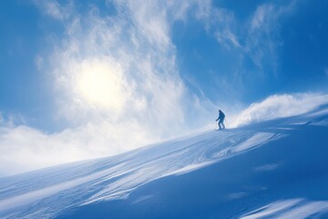 skier enjoying clear blue sky and bright sunshine on slope