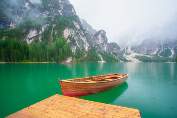 Wall Mural - boat on lake braies, dolomites, italy. lake and reflections on the water surface. mountain landscape