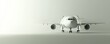 © Aris Suwanmalee - A minimalistic view of an airplane on a grey background, symbolizing air travel.