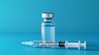 © MdRowshan - Vaccine Vial and Syringe Medical Injection, Treatment on Blue Background