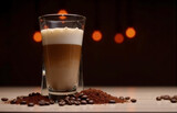 A Glass of Coffee with Frothy Top and Coffee Beans