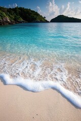Poster - Serene tropical beach scene with turquoise water gently lapping onto the sandy shore under a clear blue sky offering a tranquil and idyllic vacation escape