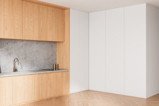 Modern kitchen interior with empty white wall and wooden cabinets for poster or design mockup in minimalist home decor setting. 3D Rendering