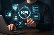 © ณภัทร วงค์มาวิวัฒน์ - Key Performance Indicator (KPI) Mastery: A focused individual, engrossed in the task of monitoring and analyzing key performance indicators, is immersed in the world of data-driven strategies.