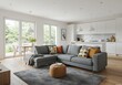 © Muaz - A bright living room featuring a gray sectional sofa with colorful pillows and a modern kitchen area