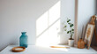 © lily - Sunny artist's workspace, teal vase, plant
