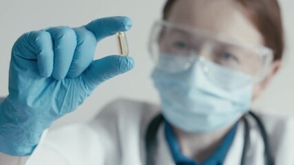 Aufkleber - A researcher in protective gear inspects a pharmaceutical capsule, emphasizing the precision and commitment vital in pharmaceutical research to enhance healthcare and patient outcomes