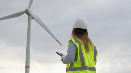 Poster - A skilled female engineer in safety gear inspects a wind turbine and analyzes data on a tablet, emphasizing the vital role of renewable energy and advancements in the green energy sector