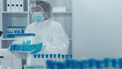 Aufkleber - In a hightech lab, a diligent scientist in protective gear skillfully handles test tubes and advanced instruments while demonstrating various procedures and ongoing research activities