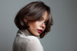 © Rocher Creative - beautiful woman with ash brown wavy layered bob hairstyle, haircut with bangs, in luxury salon