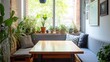 © Sawat - Cozy breakfast nook in condo kitchen with natural lighting and modern decor