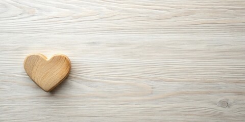 Poster - A solitary, light-colored wooden heart rests gently on a softly textured, pale wood surface, leaving ample space for your message or design.