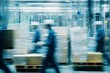 © Jamlong - Motion Blur of Workers Transporting Boxes in Warehouse Environment