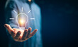 © otello-stpdc - Businessman hands showing light bulb for thinking new idea concept. Innovative technology with innovation. Inspiration of ideas for sustainable business development and communication concepts