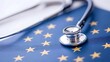 © CHURIN - Stethoscope rests on a flag depicting a circle of stars on a blue background, symbolizing healthcare within a political union