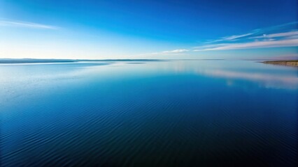 Poster - Serene Aquatic Landscape  Vast expanse of tranquil blue water under a clear sky, gentle waves reflecting the light, a picturesque horizon line