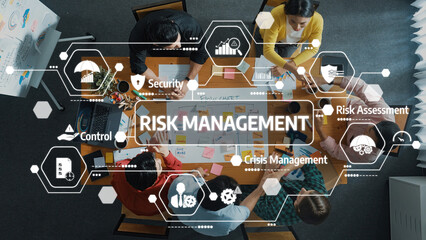 Poster - a diverse team engages in a focused discussion on risk management strategies, utilizing visual aids 