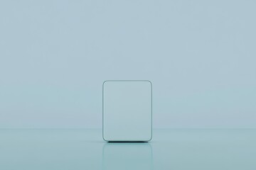 A blank white mockup of a turquoise computer screen, made from a single material, embodies a minimalist concept