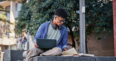 Poster - Reading book, student or man on laptop for course, studying or research on internet. Education, campus or learner with headphones, school notes or technology for knowledge, university and website