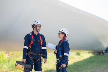 Wall Mural - engineer team working in wind turbine farm. maintenance engineer working in wind turbine.