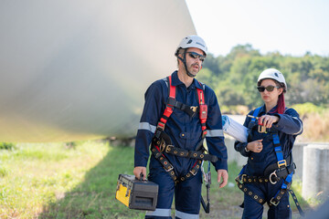 Wall Mural - engineer team working in wind turbine farm. maintenance engineer working in wind turbine.