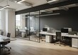 © Muaz - Interior view of a modern office space with glass partitions and multiple computer workstations setup nicely