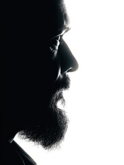 Poster - Silhouette of a Bearded Man With a Fade Effect Against a Clean White Background, Showcasing a Thoughtful Expression in Profile
