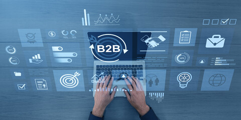 Poster - Businessman using laptop with B2B marketing icons on digital interface screen.