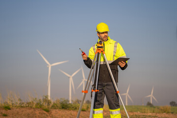 Aufkleber - Engineer man working with tablet at windmill farm Generating electricity clean energy. Wind turbine farm generator by alternative green energy.