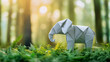 © joybackground96 - Origami paper of elephant in forest with sunlight, free space for text