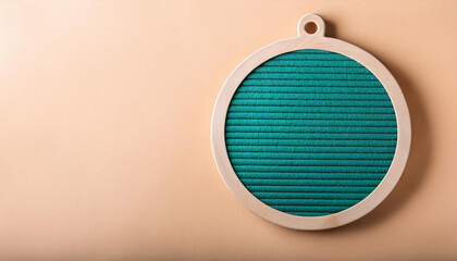 Aufkleber - Round decoration. Green felt board into a bright wooden frame. Space for text. Idea for seasonal celebration. Blank space for writing. On light wall. Flat lay. Warm color background.