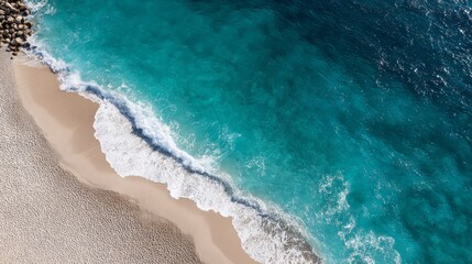 Poster - A calm shoreline features soft beige sand blending with gentle turquoise waves, creating a serene coastal landscape with ample space for design elements
