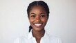 © M Alfan Setyawan - Portrait Smiling Black Woman with Braids Wearing a White Shirt Against a Neutral Background Studio Shot