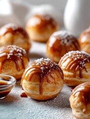 Aufkleber - Delicious Profiteroles Topped With Glossy Caramel Glaze and Sugar Dust on a Clean Tabletop, Perfect for Any Dessert Lover